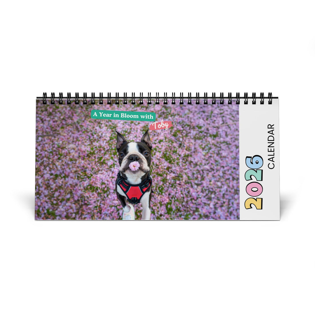 2026 calendar with a dog in a field of flowers on the cover