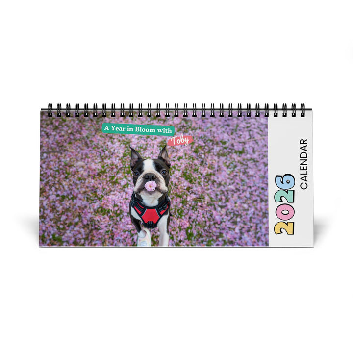 2026 calendar with a dog in a field of flowers on the cover