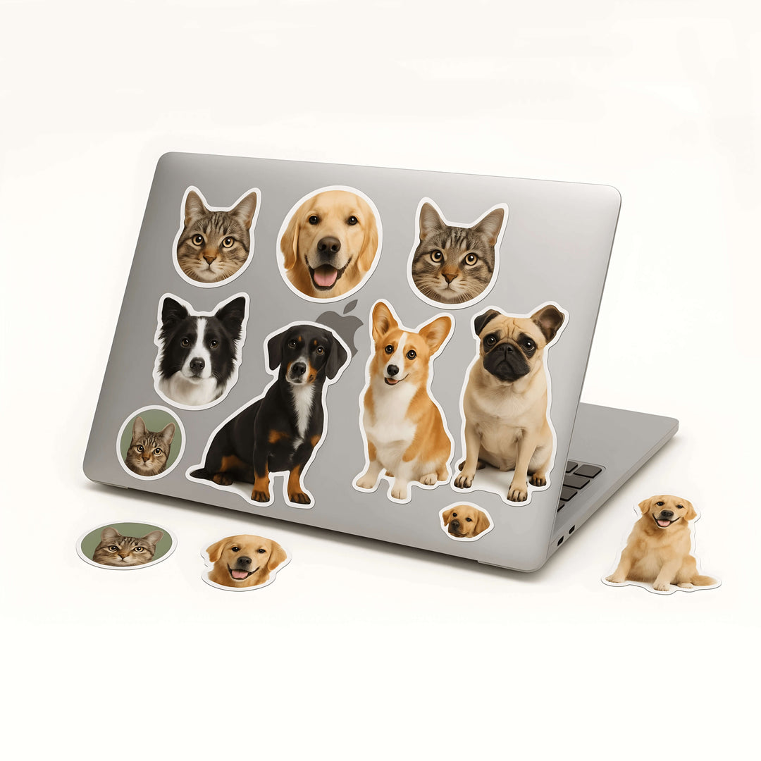 Laptop with stickers of dogs and cats on a white background

