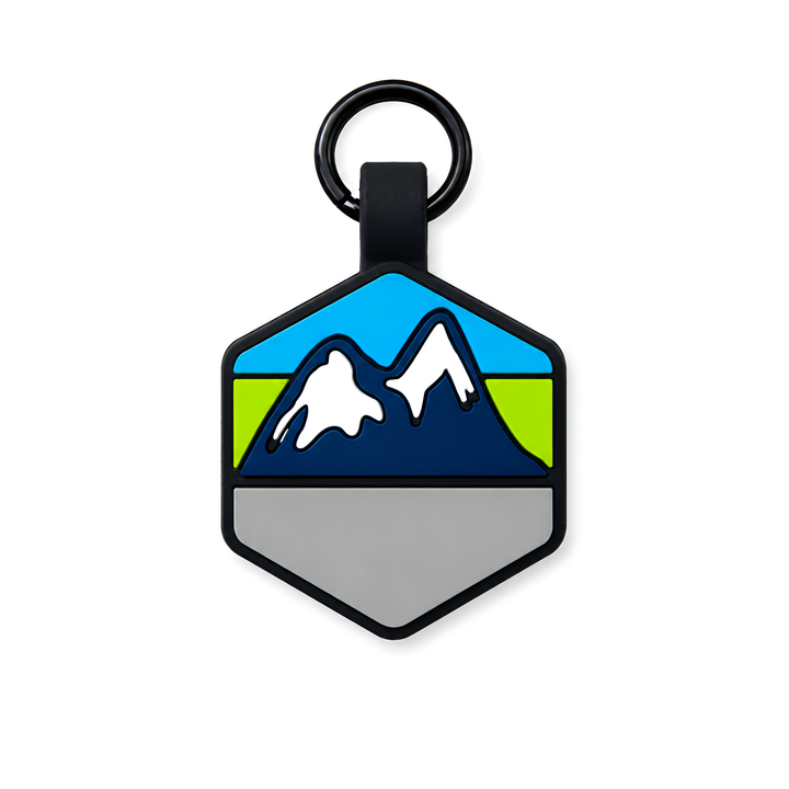 Hexagonal dogtag with mountain design on a white background